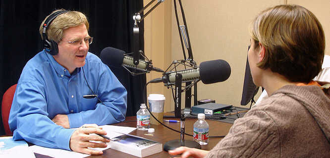 Rick Steves interviewing a studio guest